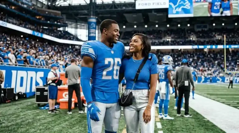 jahmyr gibbs girlfriend nicole anderson standing on detroit lions stadium sidelines